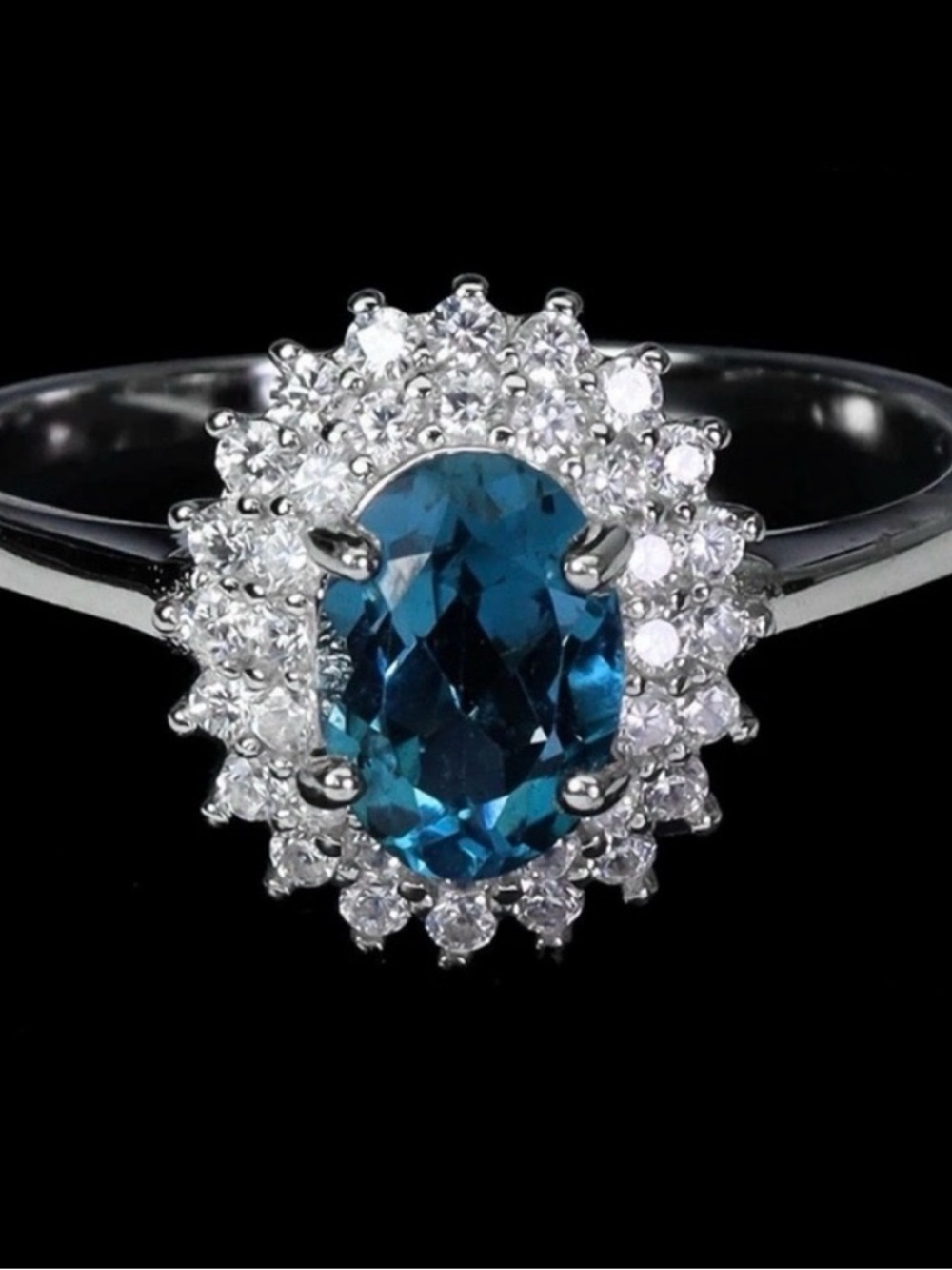 Stunning Natural oval cut London Blue Topaz .80CT with Zircon halo Ring Size 6.5
